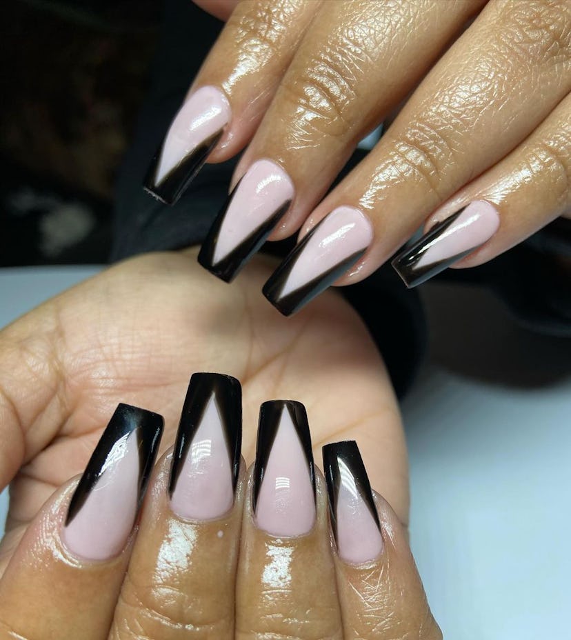 Glossy black "tuxedo" tipped nails are on-trend.