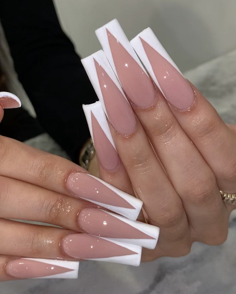 Classic white French tip “tuxedo” nails are on-trend.