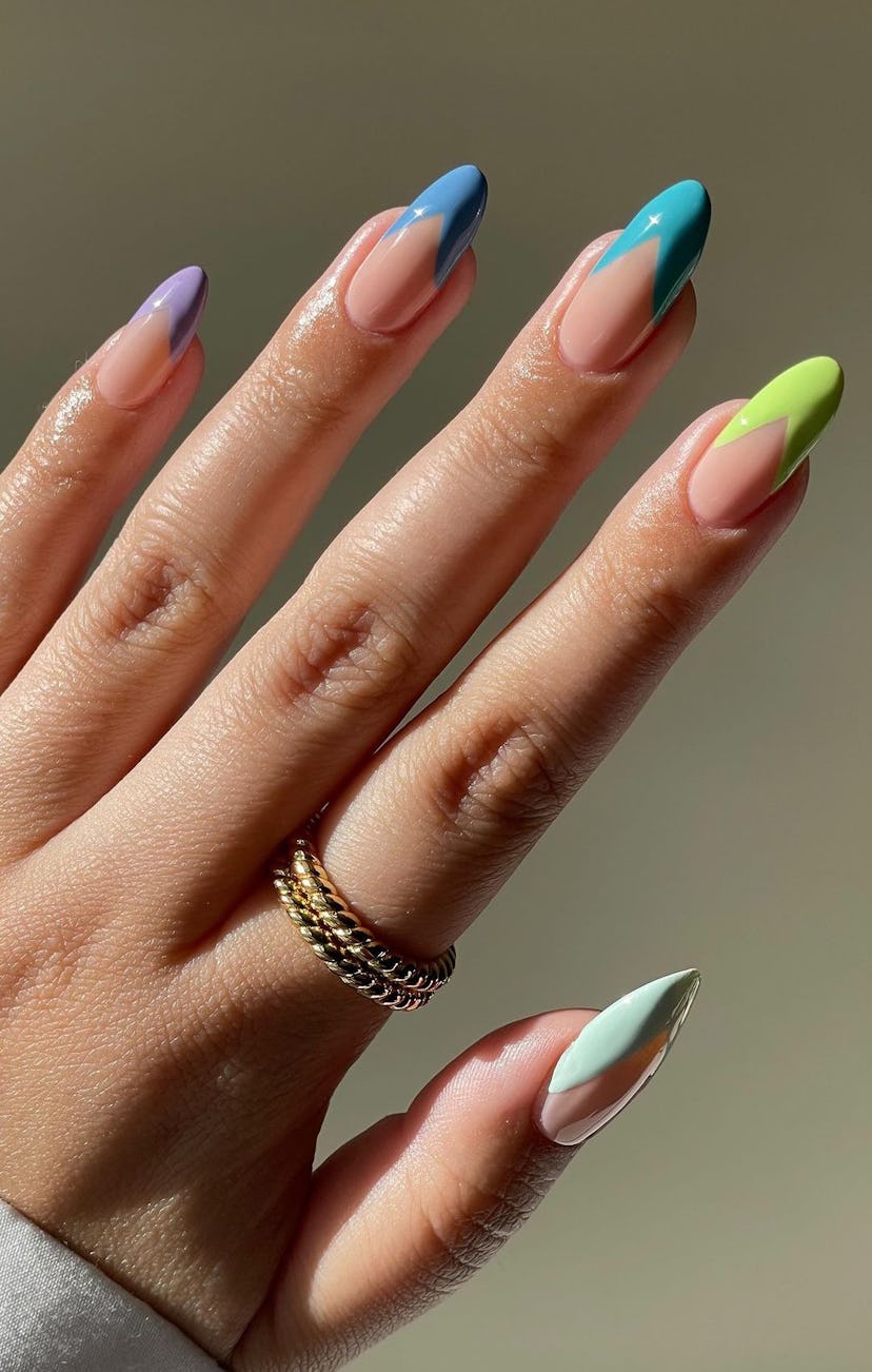 V-shaped Skittle French tip nails are on-trend.