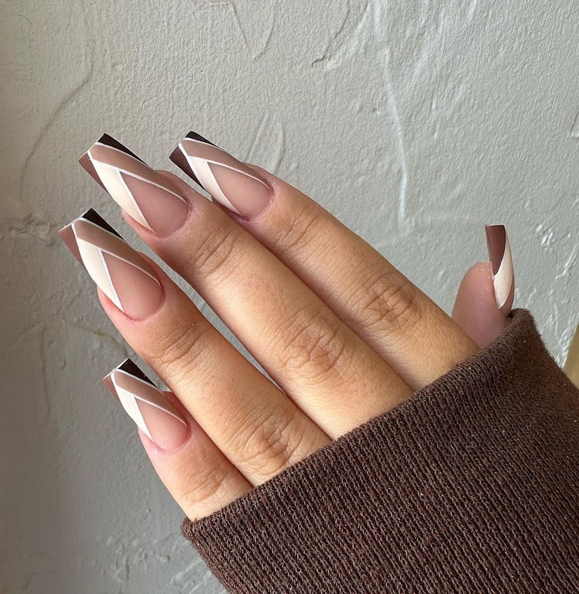 Monochromatic V-shaped chevron nails are on-trend.