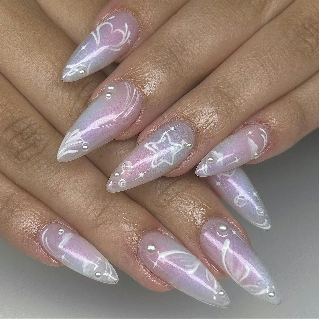 Airbrushed stars and hearts are on-trend for Pisces season 2024.