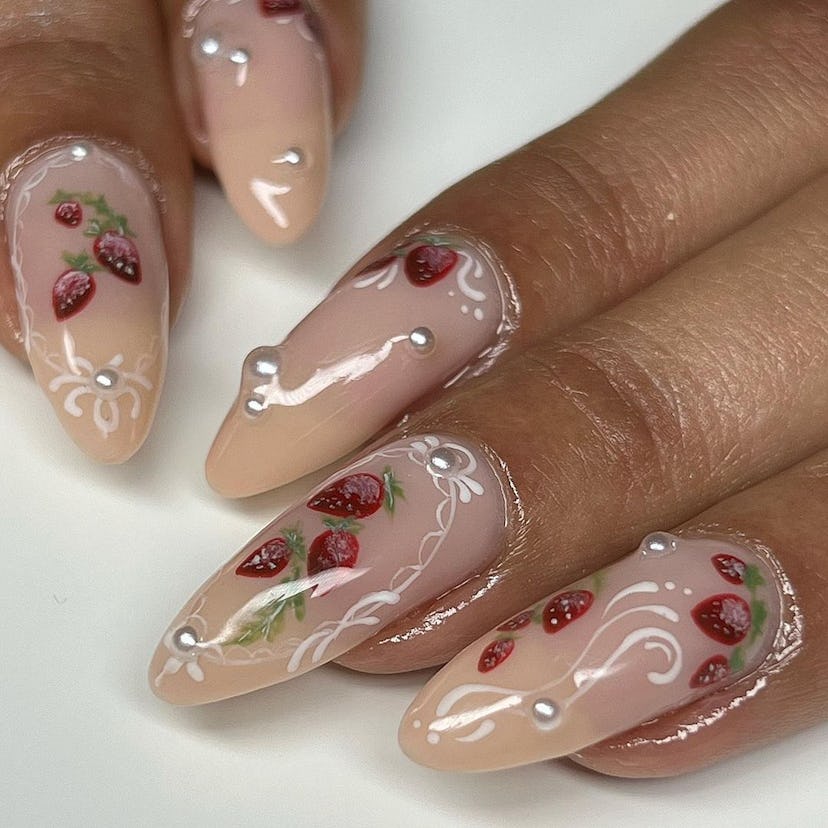 Coquette strawberry nail art designs are on-trend for Pisces season 2024.