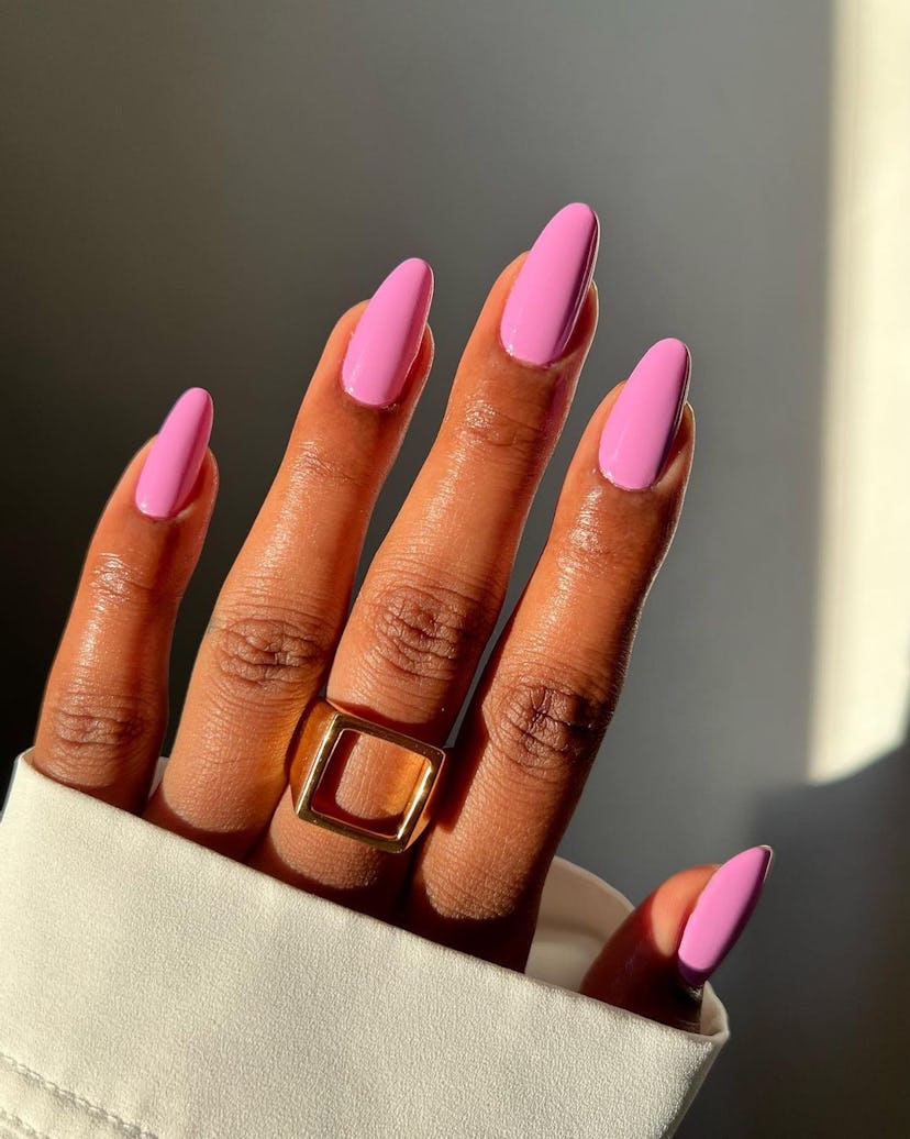 Shades of vibrant pink are on-trend nail polish colors for spring 2024.