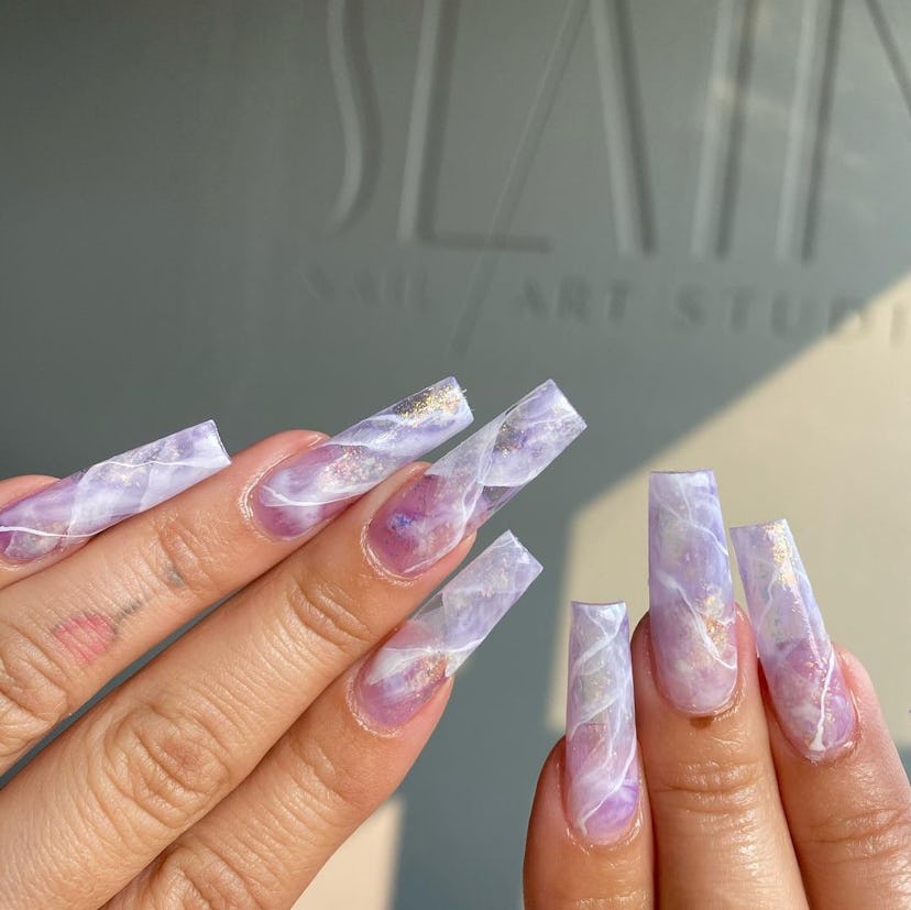 Marble amethyst nails are on-trend for Pisces season 2024.