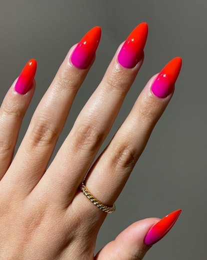 Red and pink two-toned nails are on-trend for 2024.
