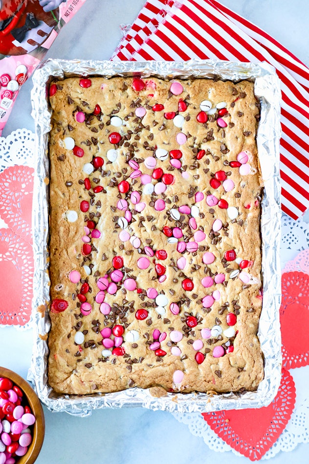 Chocolate chip cookie bars with M&Ms, which are easy Valentine's Day cookies to make with kids.