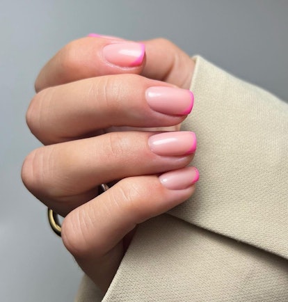 Hot pink micro French tip nails are on-trend for 2024.
