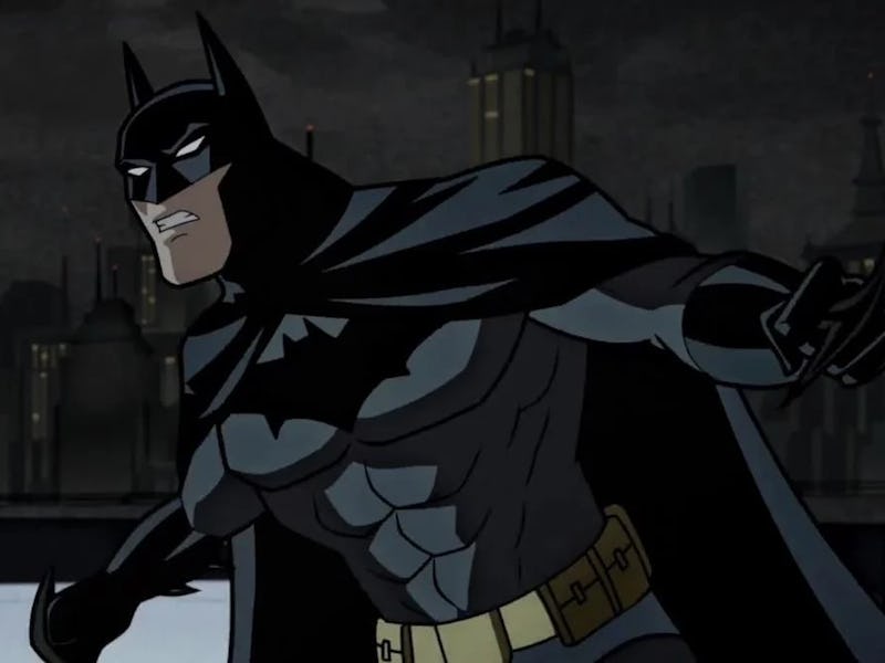 Animated Batman stands ready on a rooftop at night with a city skyline in the background.