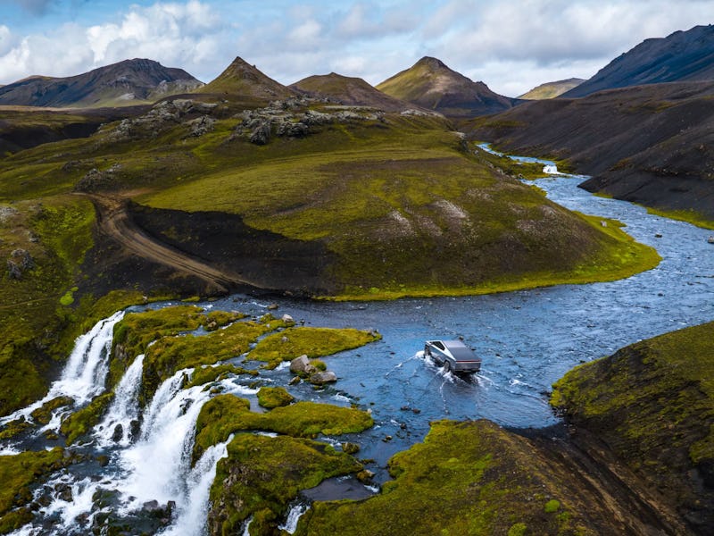 Tesla Cybertruck traversing a shallow water crossing.
