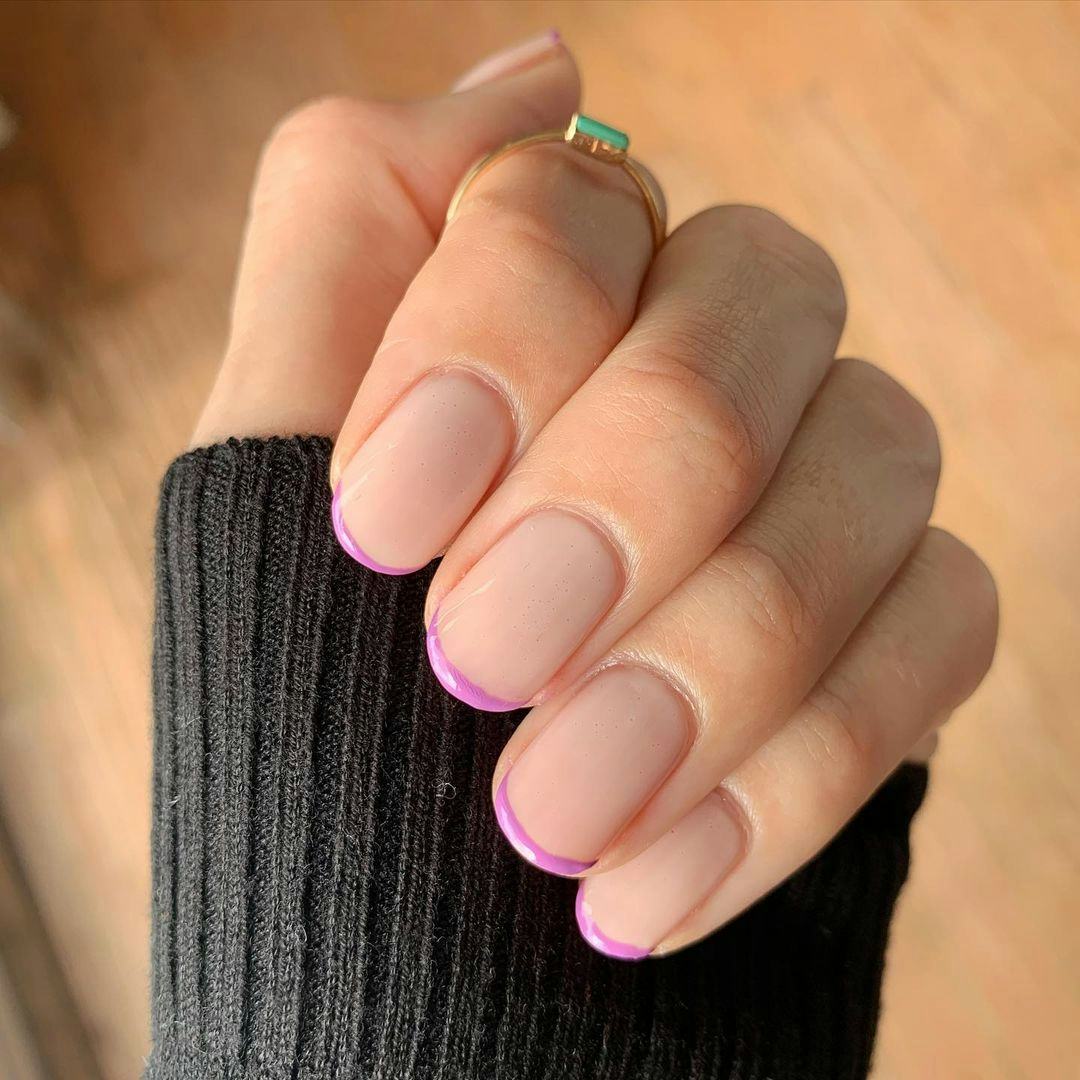Purple micro French tip nails are on-trend.
