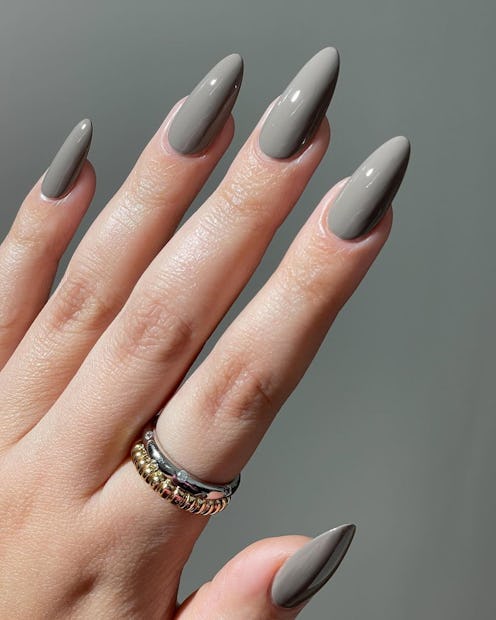 Gray nails are trending for spring, partially thanks to Alix Earle's "stone" manicure.