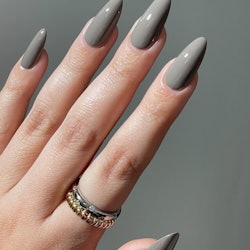 Gray nails are trending for spring, partially thanks to Alix Earle's "stone" manicure.