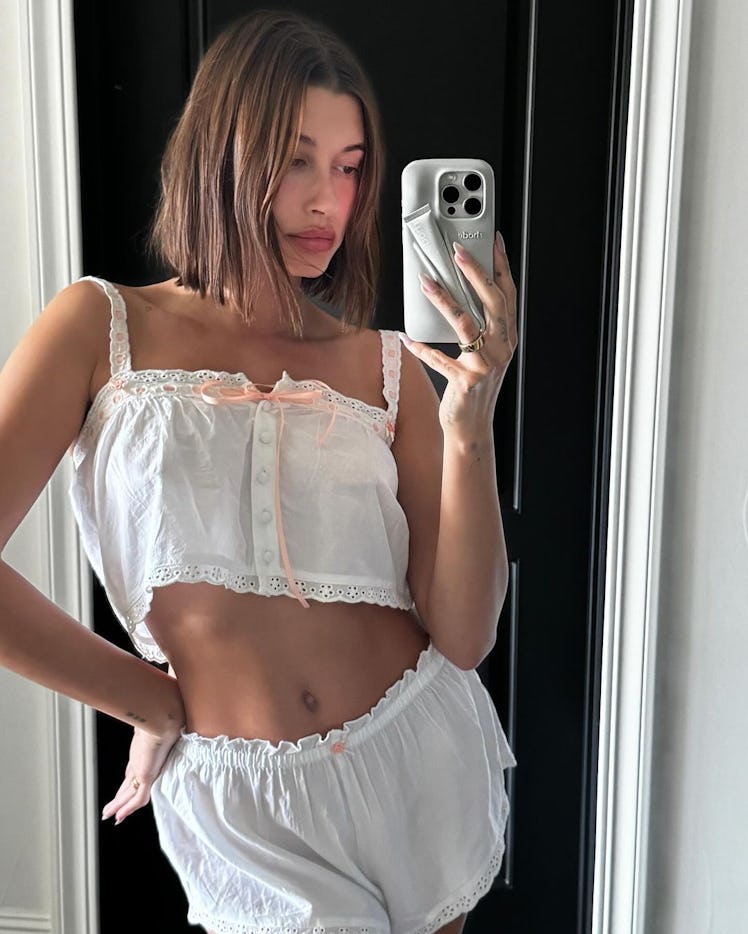 Hailey Bieber showing off the viral Rhode Lip Case available for pre-order now. 