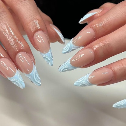3D baby blue French tip nails are on-trend.