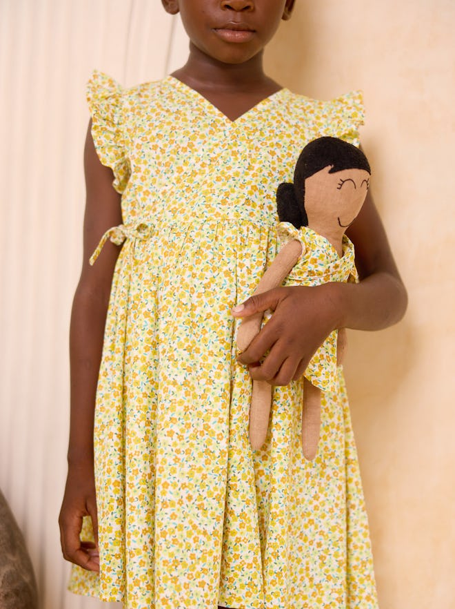 Yellow floral wrap dress that would make the perfect easter 2024 outfit for girls.