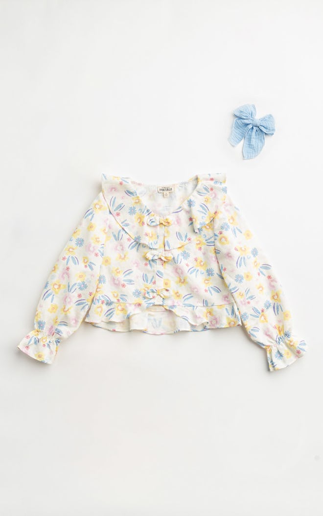 Ruffled long sleeve shirt with floral print, a cute easter 2024 outfit for kids.
