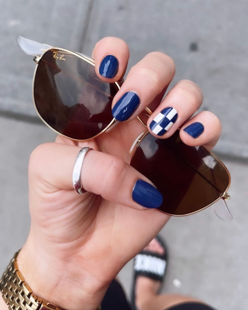 Navy checkerboard nail art designs are on-trend.