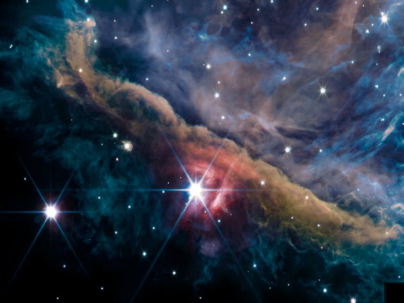Colorful cosmic clouds and bright stars in a deep space nebula.