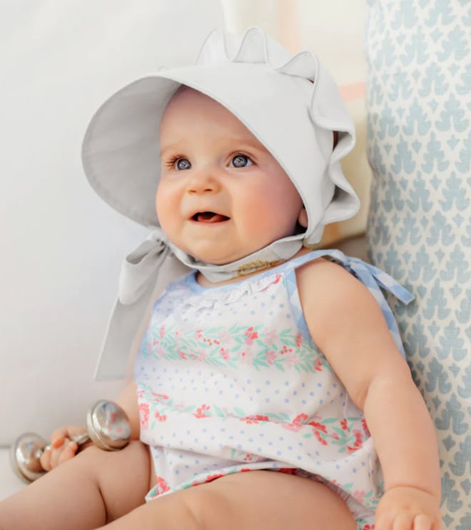 Classic white baby bonnet, the perfect accessory for easter 2024 outfits for babies.