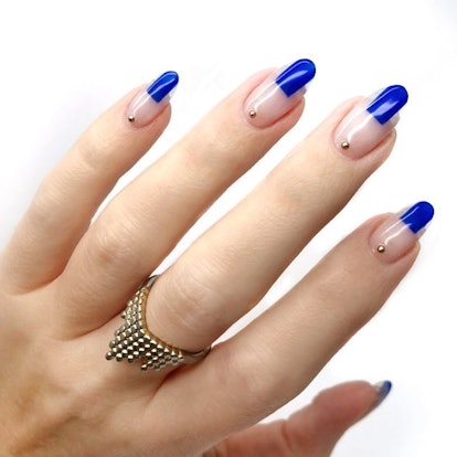Abstract blue nail designs are on-trend.