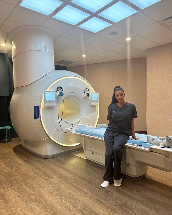 Kim Kardashian sits on the Prenuvo MRI machine.