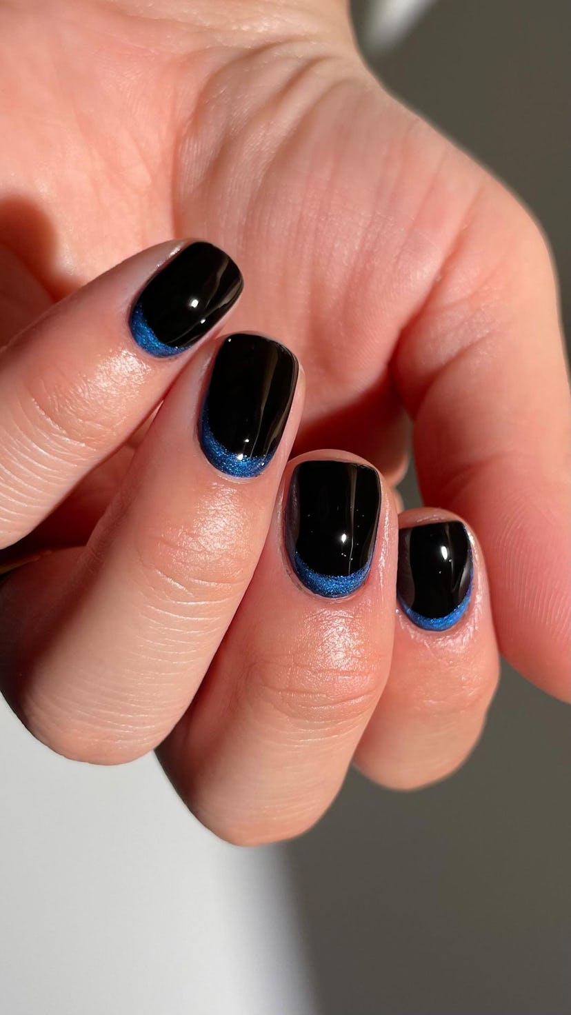 Metallic blue nail cuffs are on-trend.