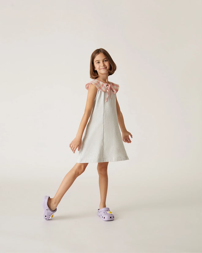 White dress with pink gingham shoulder accents, an easter 2024 dress for girls.