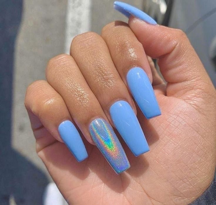 Blue nails with holographic details are on-trend.