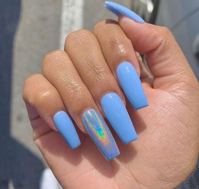 Blue nails with holographic details are on-trend.