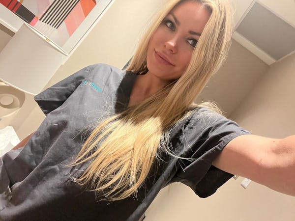 Crystal Hefner takes a selfie in Prenuvo's scrubs.