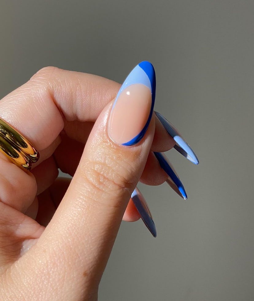 Two-toned abstract French tip nails are on-trend.