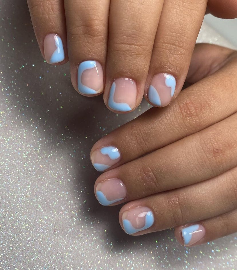 Pastel blue abstract nail designs are on-trend.