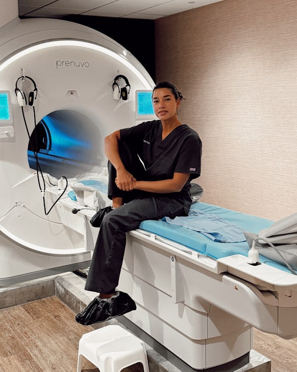 Hannah Bronfman poses on the Prenuvo MRI bed.