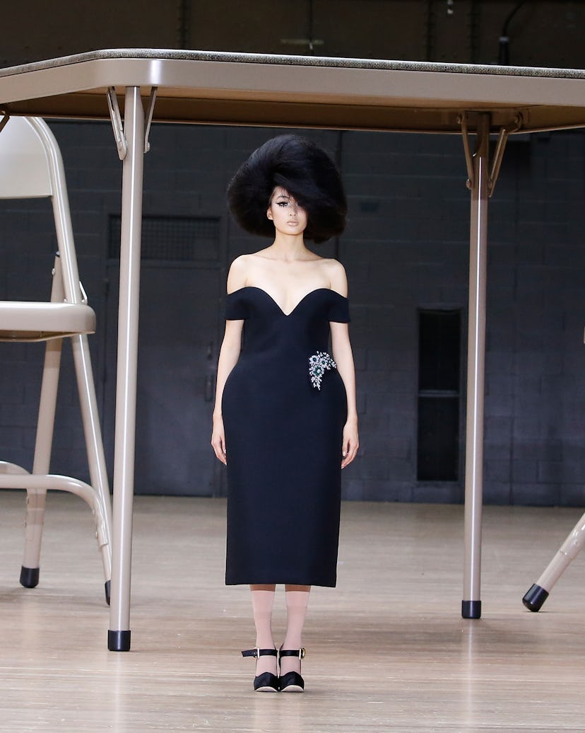 model wearing black dress