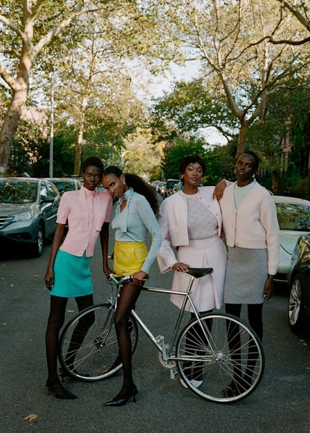 Four models wearing colorful outfits on a Brooklyn street