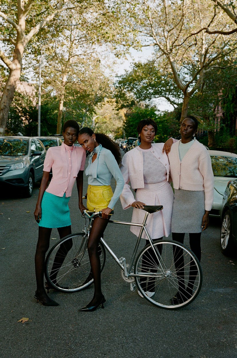 Four models wearing colorful outfits on a Brooklyn street