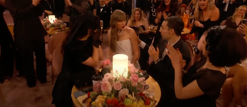 Taylor Swift reacting to winning Album of the Year at the 2024 Grammys. 