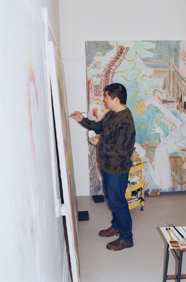 Ding Shilun painting in his studio