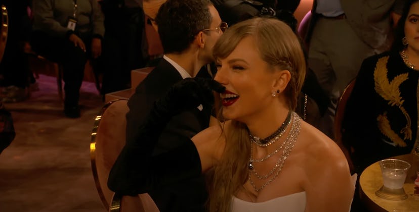Taylor Swift laughing at Trevor Noah's joke