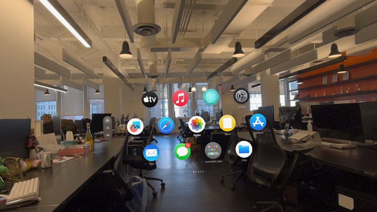 Home view in Apple Vision Pro. The app icons just float in mid-air in your surroundings.