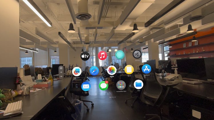 Home view in Apple Vision Pro. The app icons just float in mid-air in your surroundings.