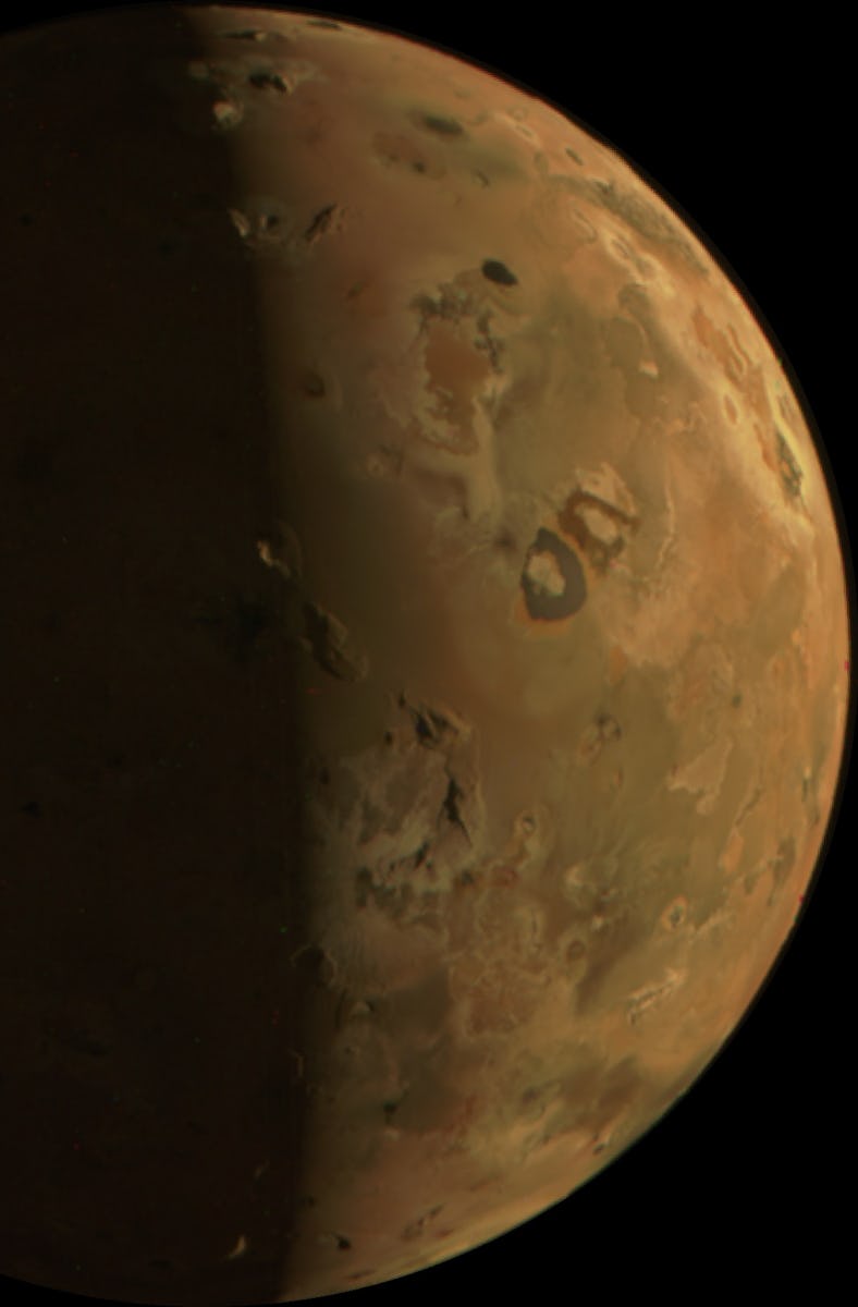 A detailed image of the planet Mars, showing its reddish surface and dark markings against the black...