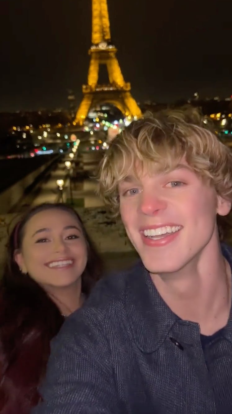 Jack Wright and Sky Katz film a TikTok in front of the Eiffel Tower. 