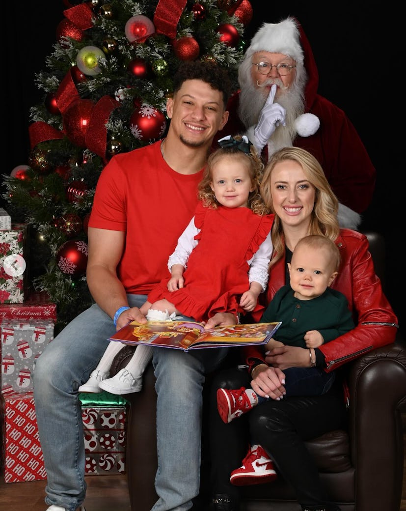 Brittany, Patrick, Sterling, and Bronze Mahomes in a Christmas photo with Santa.