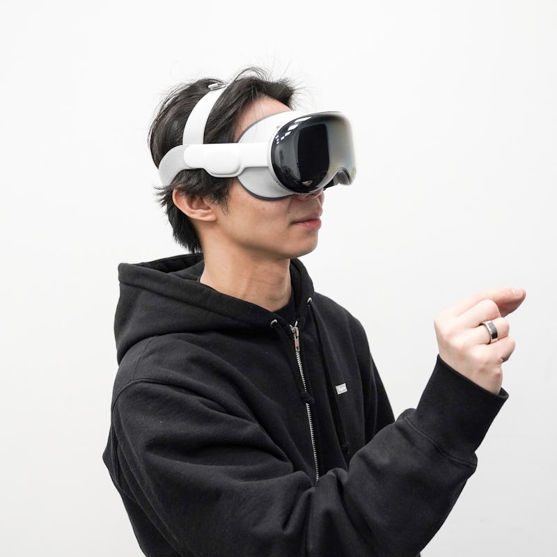 wearing the Apple Vision Pro and selecting something in the interface.