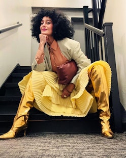 Tracee Ellis Ross fluffy curls and yellow skirt