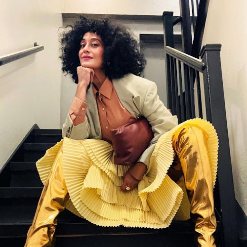 Tracee Ellis Ross fluffy curls and yellow skirt