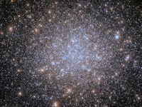  A cluster of stars. Most of the stars are very small and uniform in size, and they are notably blui...