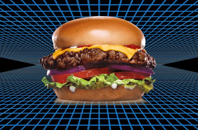 A delicious Carl's Jr. burger with a beef patty, tomatoes, lettuce, cheese, and ketchup.