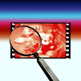 Magnifying glass over a film strip showing a red-toned image of a woman inside a car, creating a det...